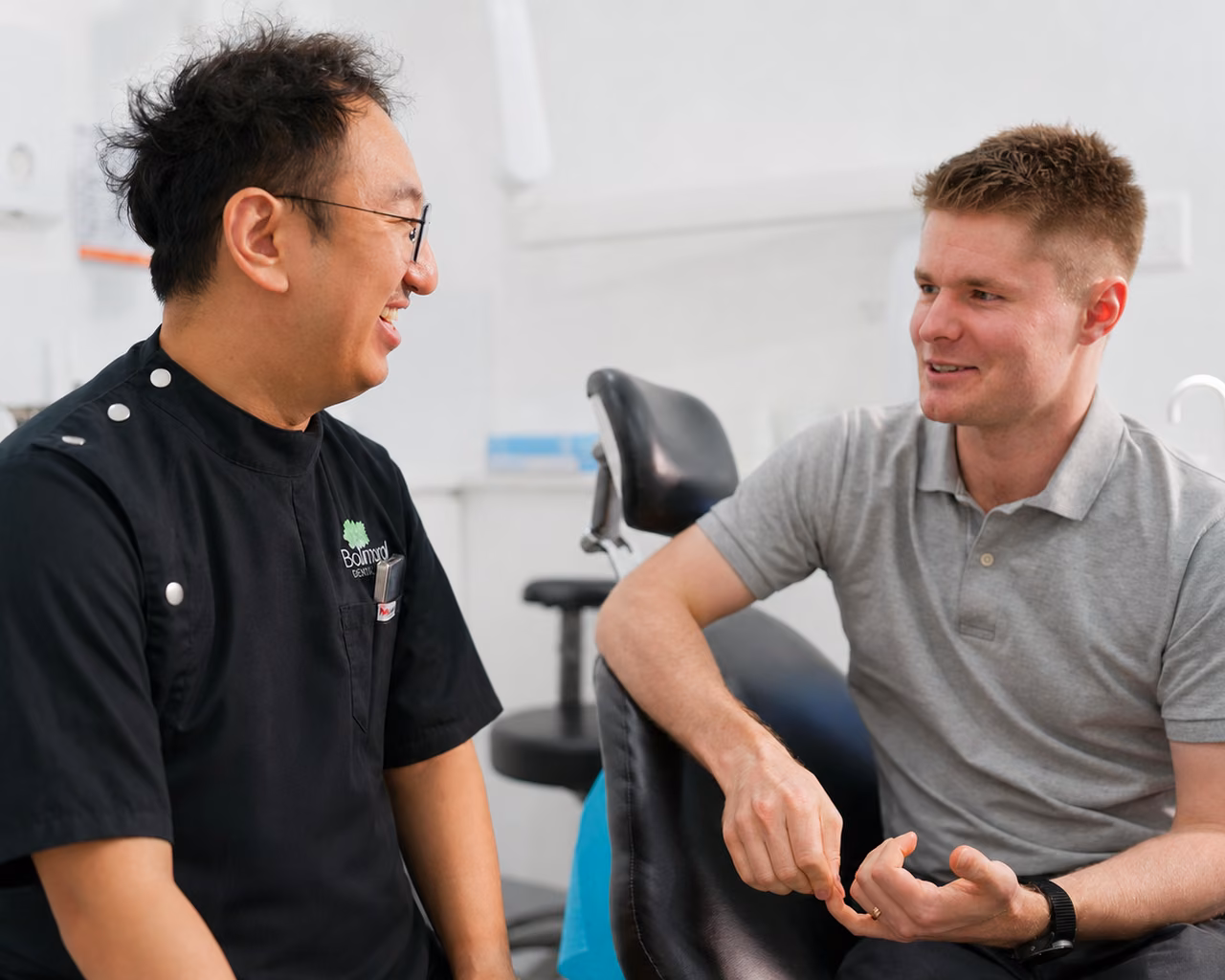 Balmoral Dental clinician speaking with a patient in the clinic