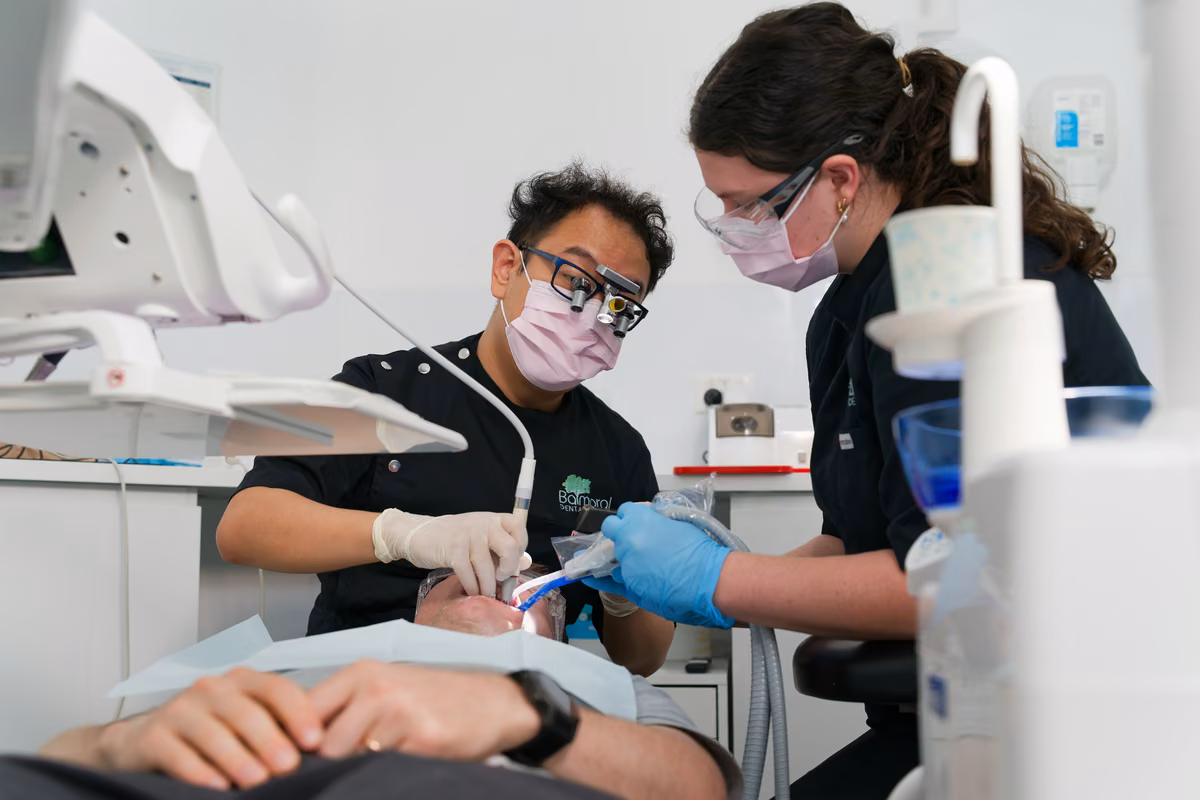 Balmoral Dental clinician using Prophy-Mate during a clean